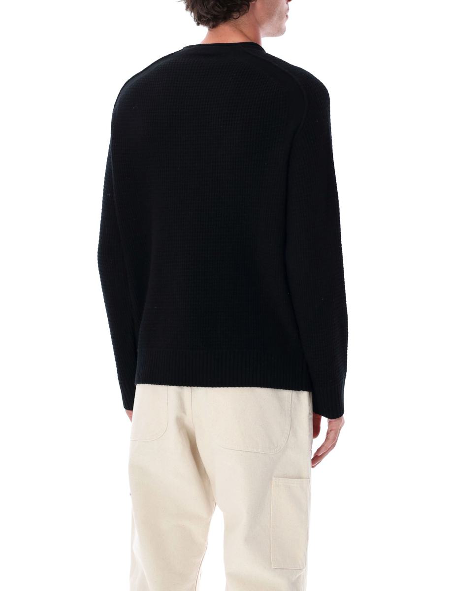 Stone Island – Schwarzer Fisherman-Pullover aus gerippter Wolle