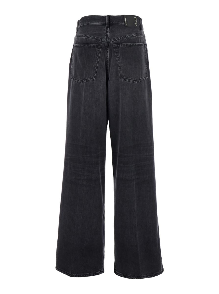 Schwarze Jeans mit Falten vorne und Logo-Patch auf der Rückseite aus Baumwolle für Damen