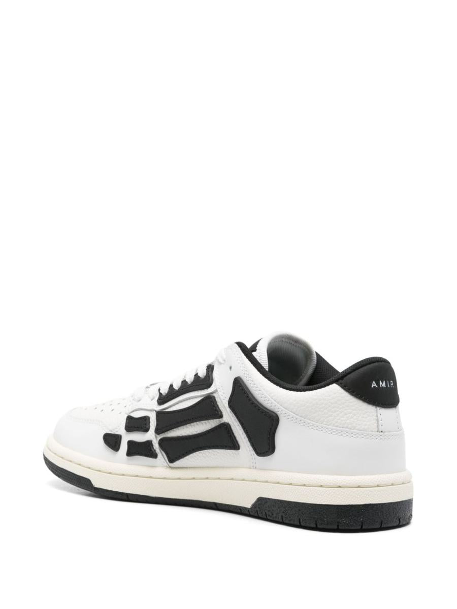 Amiri – Weiße Ledersneaker mit schwarzen Details
