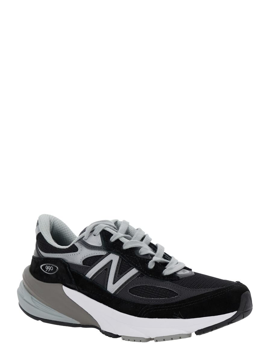 Schwarze Low-Top-Sneakers mit Logo-Detail aus Wildleder und technischem Gewebe für Damen