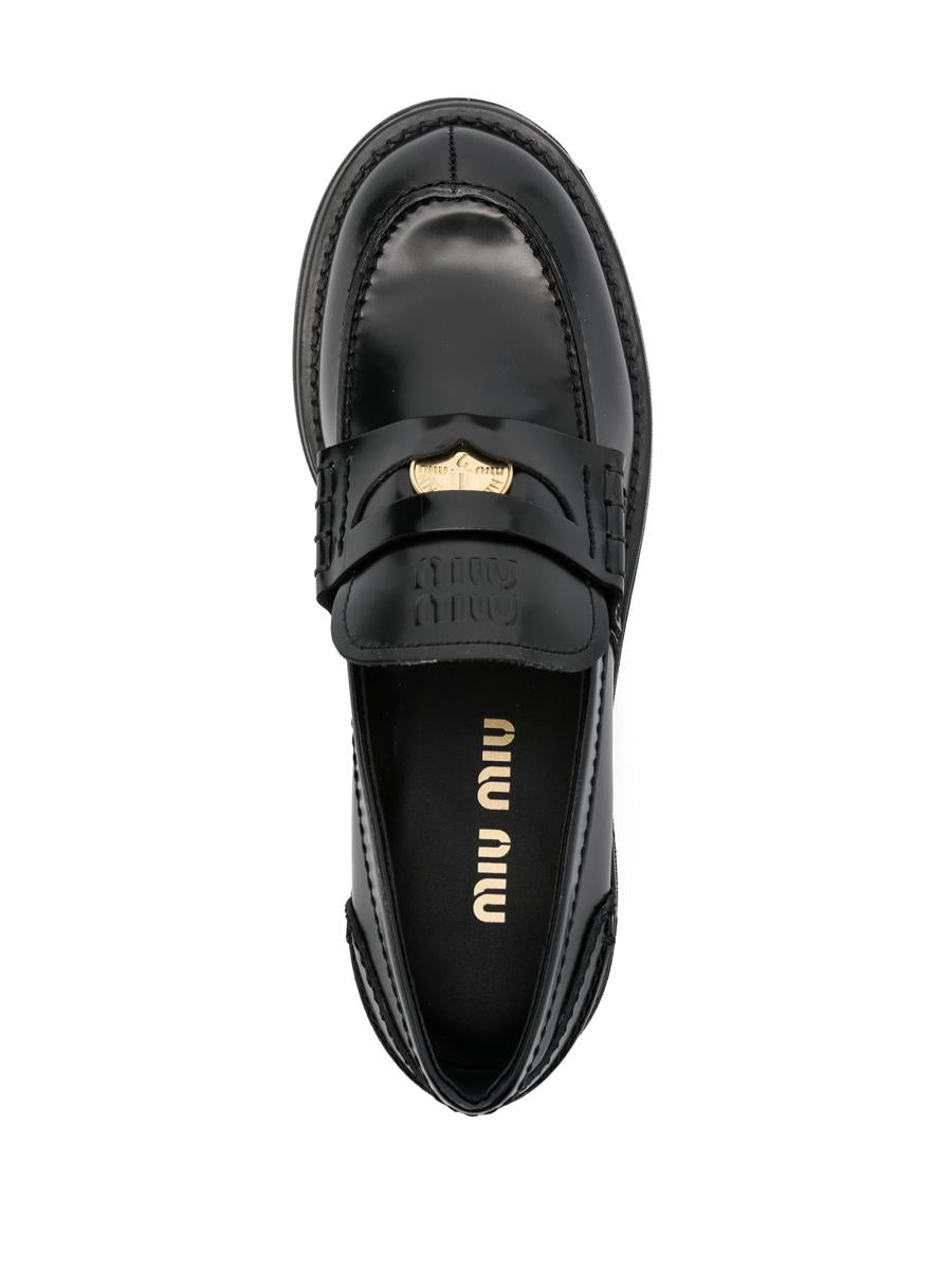 Miu Miu Pennyloafer aus gebürstetem Leder