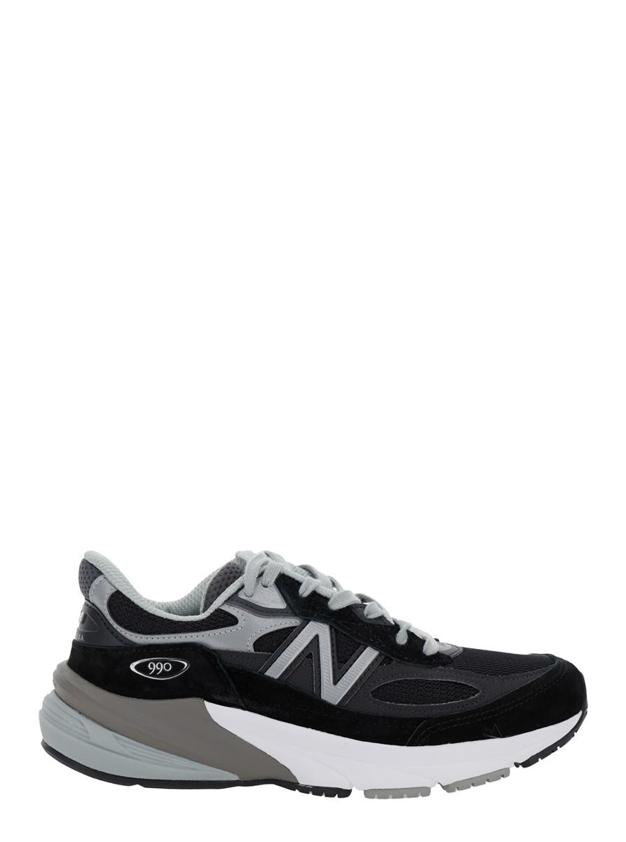 Schwarze Low-Top-Sneakers mit Logo-Detail aus Wildleder und technischem Gewebe für Damen